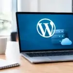 Managed WordPress hosting for business: laptop on a wooden desk showing the WordPress logo beside server and cloud icons